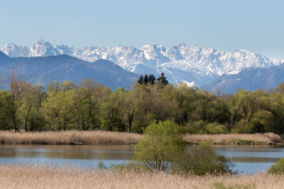 Scenic view of lake with mountains in background