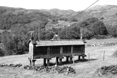 Built structure on landscape against sky