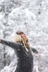 Close-up of woman on snow covered land