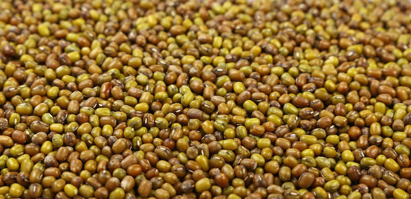 Full frame shot of green lentils for sale in store