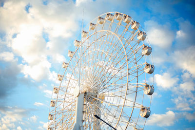 Low angle view of ferris wheel against sky