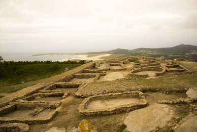 High angle view of old ruins against sky