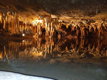 Reflection of cave in water