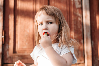 Portrait of cute girl holding ice cream