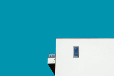 Low angle view of building against clear blue sky