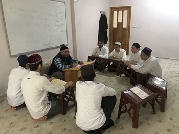 Group of people sitting on table