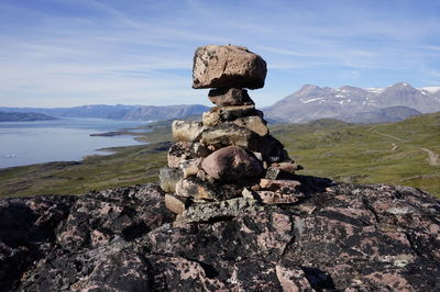 Stone wall on mountain against sky