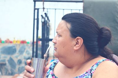 Close-up portrait of a woman drinking drink