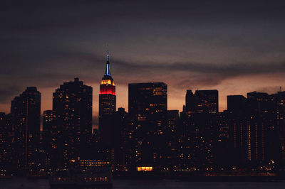 Illuminated buildings in city at night