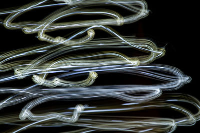 Close-up of light painting against black background