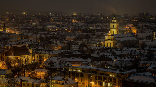 High angle view of illuminated buildings at night