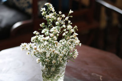 Close-up of white flower vase on table