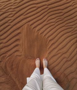 Feet in desert sand