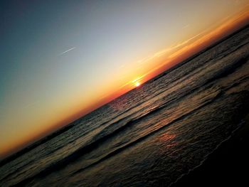 Scenic view of sea against sky during sunset