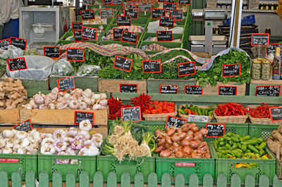 High angle view of vegetables in crates at market for sale