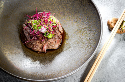 High angle view of flowers on plate