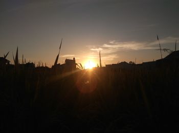 Silhouette of building at sunset