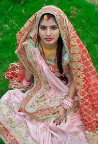 Portrait of young woman in traditional clothing
