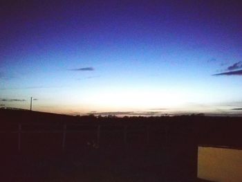 Silhouette landscape against sky during sunset