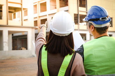 Rear view of men working