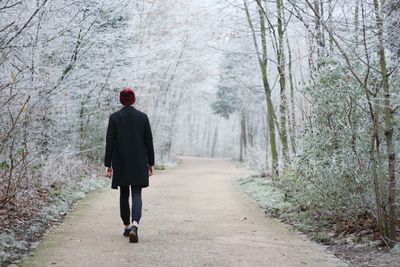 Full length rear view of man