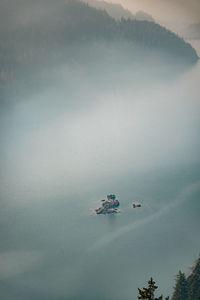 Smoke from nearby wild fires settle at diablo lake in north cascades national park in late summer. 