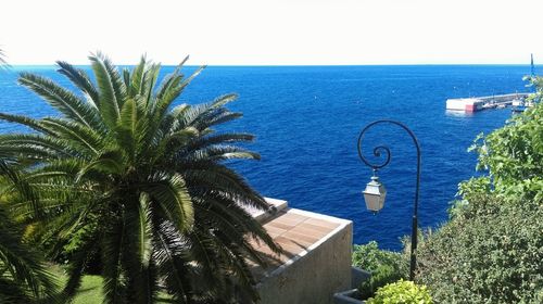 Scenic view of sea against blue sky