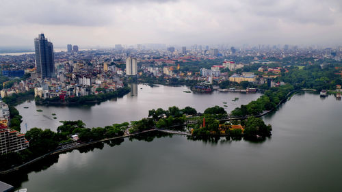 High angle view of river amidst buildings in city