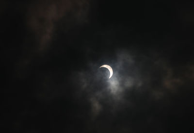 Low angle view of moon against sky at night