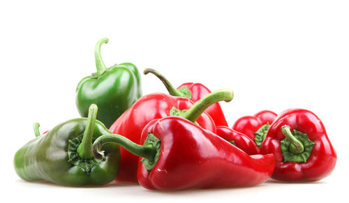 Close-up of bell peppers against white background