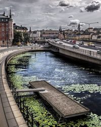 View of bridge over canal in city