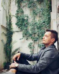 Side view of young man looking away