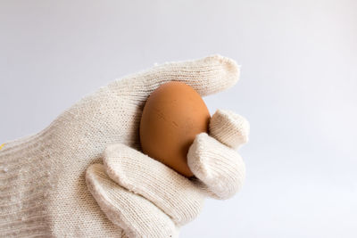 Close-up of broken toy against white background