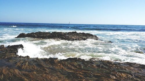 Scenic view of sea against clear sky