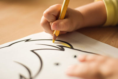 Close-up of hand holding paper