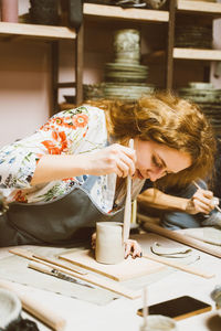 Beautiful woman working on workshop