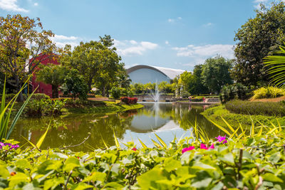 Scenic view of lake and bridge against sky