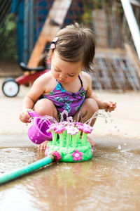 Cute girl playing in water