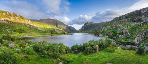Large panorama with black lake valley and mountains at sunset in gap of dunloe black valley, ireland