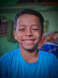 Portrait of smiling boy at home