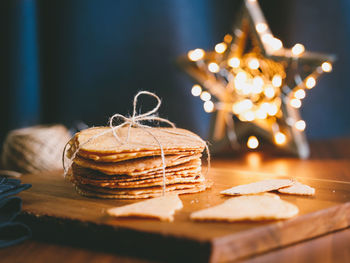 Close-up of wafer with illuminated star shape on table