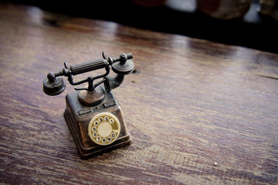 High angle view of rotary phone on table at home