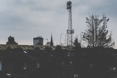 Low angle view of silhouette buildings against sky