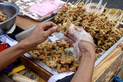 High angle view of man preparing food on table