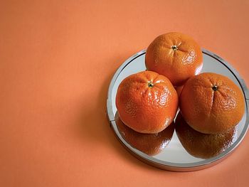 High angle view of orange fruits on table