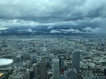 High angle view of buildings in city against sky