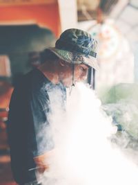 Close-up of man exhaling smoke