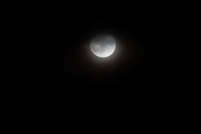 Low angle view of moon against sky at night