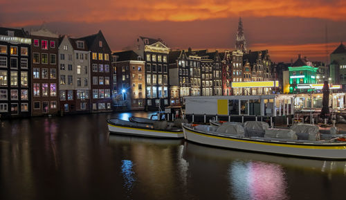 Boats moored at harbor