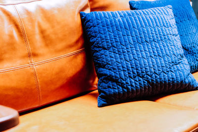 Blue cushion on sofa at home